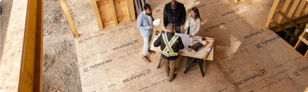 Contractors talking about installing LP TopNotch 350 subflooring.