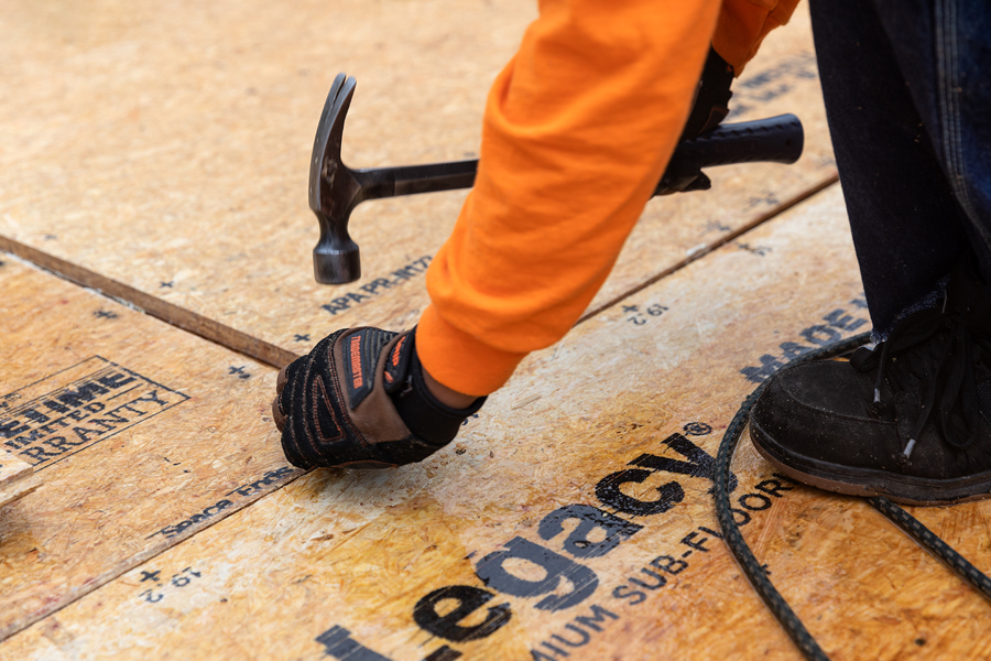 pro installing lp legacy sub-floor during construction