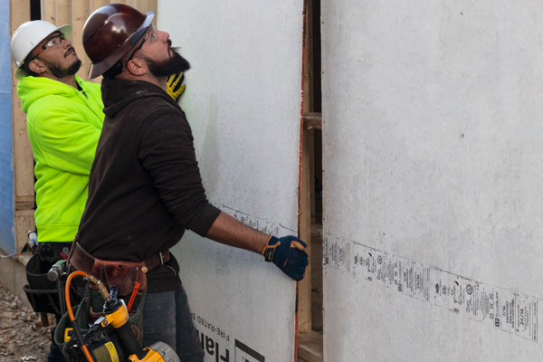 builder installing flameblock panels