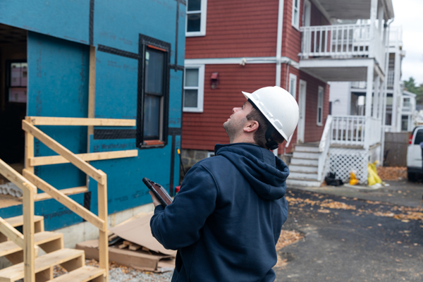 building code inspector looking at build